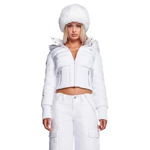 Faux fur hat featuring a wide roll-up brim and soft satin lining